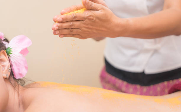 istock Spa Therapist is putting Salt scrub on women back 827344190