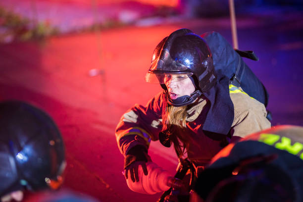 istock Female firefighter helping injured 827345142