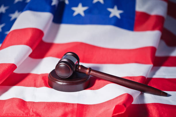istock US flag and brown gavel 827348142