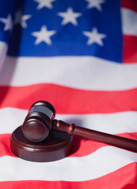 istock US flag and brown gavel 827348150
