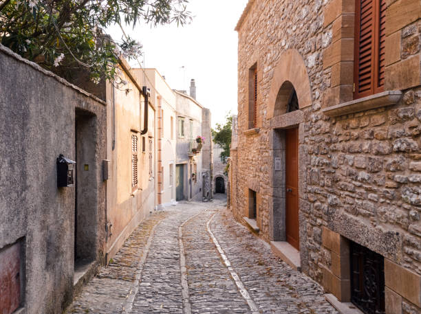 istock Ancient medieval cobblestone street in Erice, Sicily, Italy 827348266
