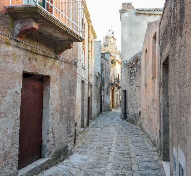 istock Ancient medieval cobblestone street in Erice, Sicily, Italy 827348516
