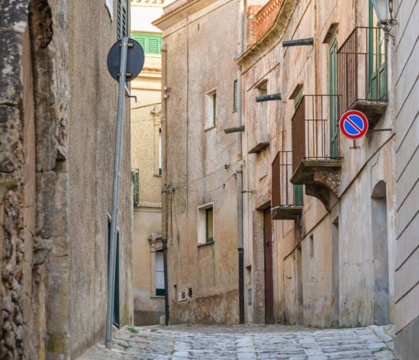 istock Ancient medieval cobblestone street in Erice, Sicily, Italy 827348552