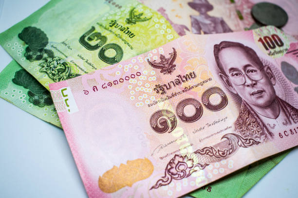 istock Thai and foreign money is placed on a white background. 827348686