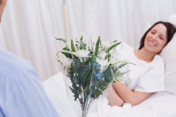 istock Flowers are brought to patient 827355496