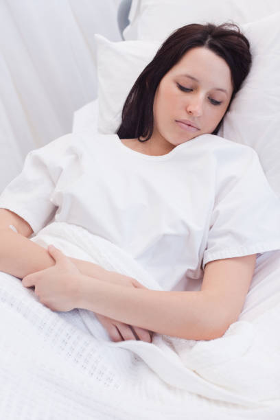 istock Woman sleeping in the hospital 827355628