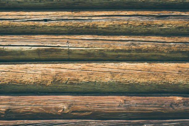 istock Wall of old logs - old texture, background 827358714