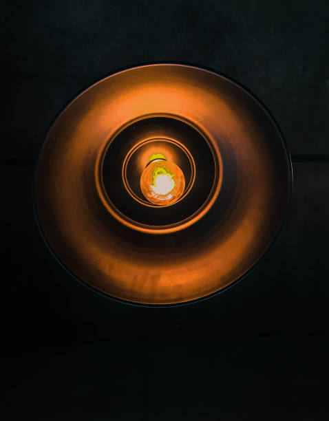 istock Big round lamp with black background 827358774