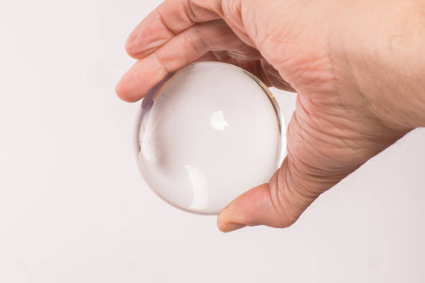 istock Crystal ball held in a man's  hand 827378968