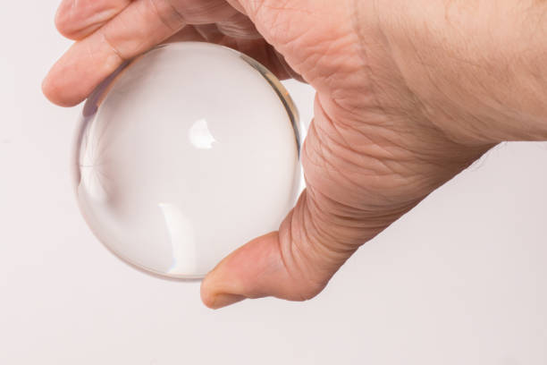 istock Crystal ball held in a man's  hand 827378972