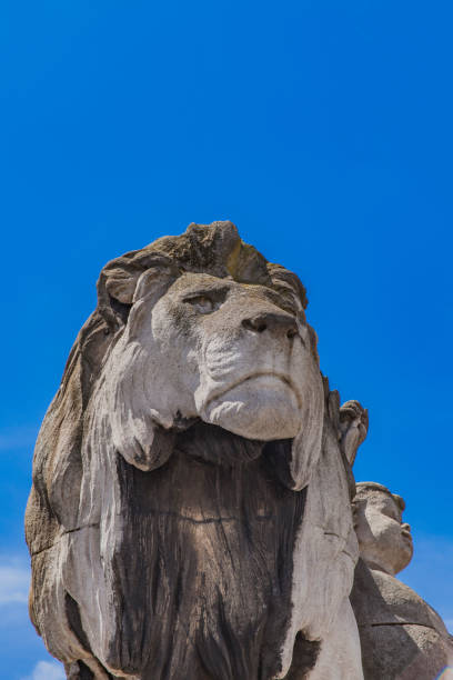 istock Statue Lion a l'enfant at Pont Alexandre III in Paris 827379646