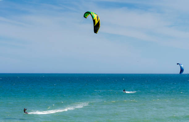 Kitesurfing Barra da Tijuca, RJ, Brasil - February 13, 2017: People practicing Kite Surf in the Barra da Tijuca beach for fun and recreation. barra beach stock pictures, royalty-free photos & images
