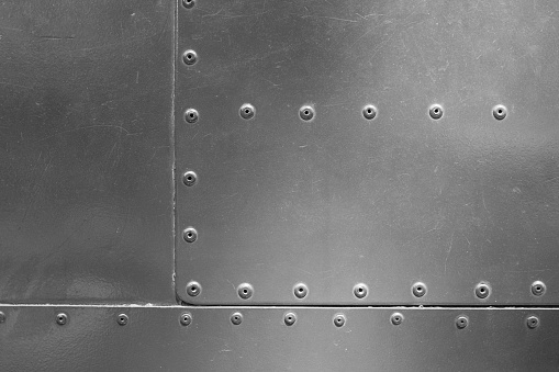 Metal plate with rivets background