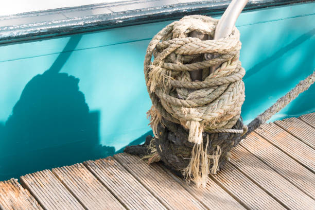 istock knot in the harbor with a blue boat 827386174