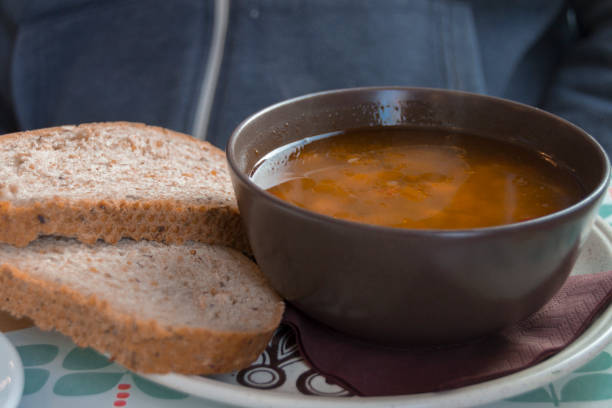 istock eating  Tomato soup in a black bowl 827386224