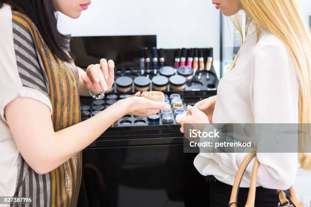 Young Pretty Woman And Beauty Consultant In Shop Stock Photo - Download Image Now - Beauty, Make-Up, Store
