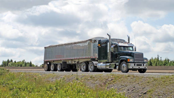 istock Semi Truck With Covered Trailer Load Travelling Highway 827390824