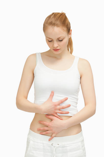 istock Woman placing her hands on her stomach 827407534
