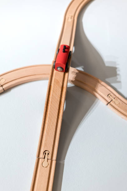 istock Red train toy on plastic wooden track isolated on white 827407832
