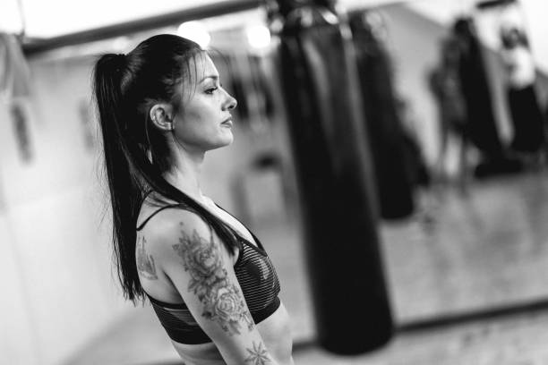 istock Young woman at her boxing training 827407894