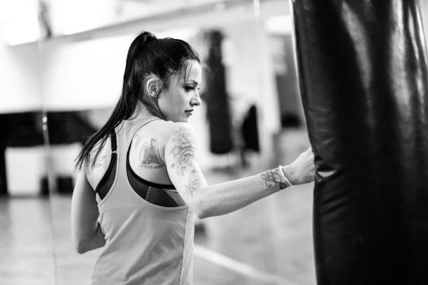 istock Young woman at her boxing training 827407974