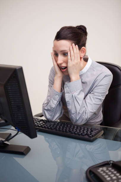 istock Businesswoman getting surprised by computer 827410528