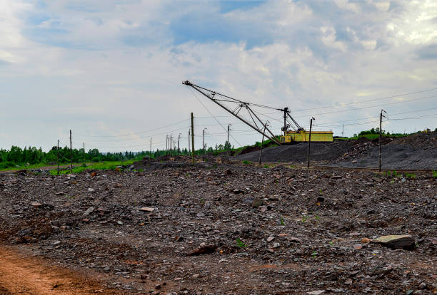 istock Excavator machine at excavation earthmoving work in quarry 827410680