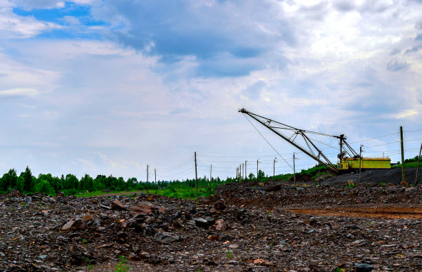 istock Excavator machine at excavation earthmoving work in quarry 827413012