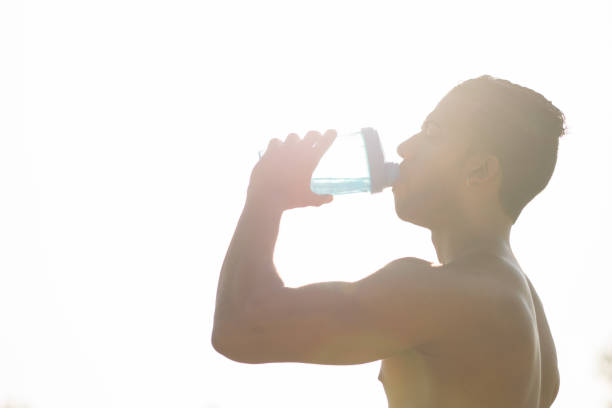 istock Young black male drinking water after doing sport 827413854
