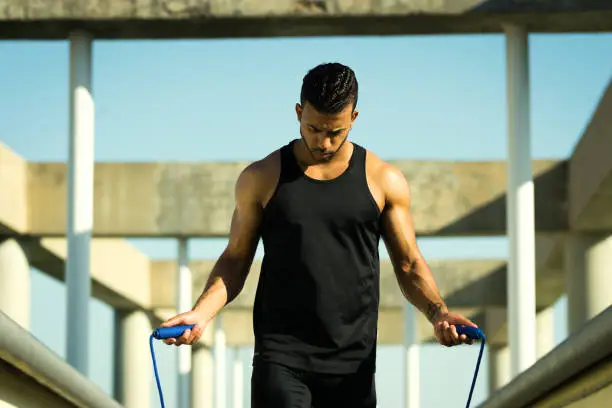 Young black male jumping rope