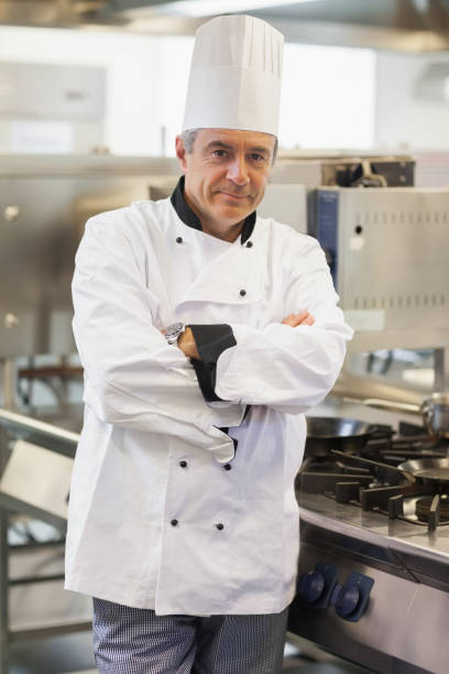 istock Chef leaning at the stove 827422920