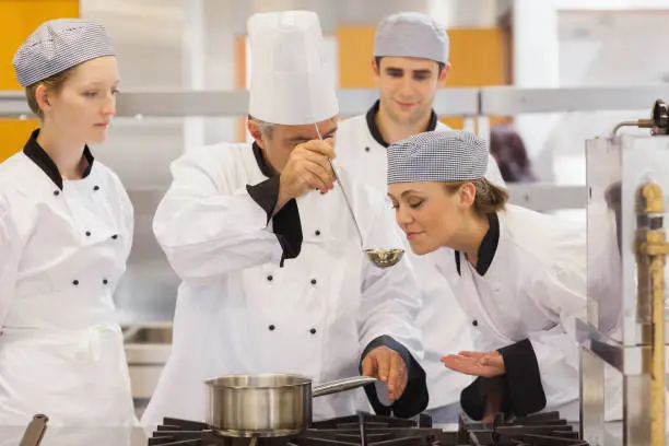 Photo of Student tasting the teachers soup