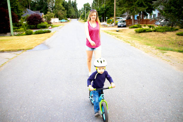 istock Learning to Ride a Bike with Mom 827425678