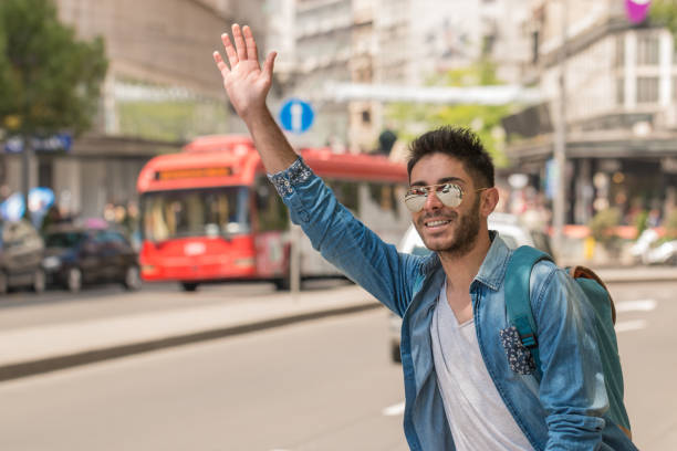istock Young Man Hailing a Taxi . 827426004