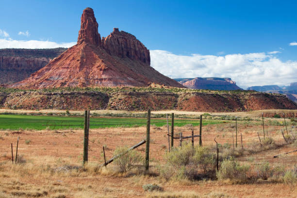 Red-Rock Mountain Spire and Irrigated Field
