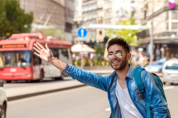 istock Young Man Hailing a Taxi . 827428844