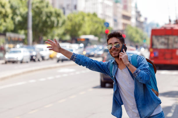 istock Young Man Hailing a Taxi . 827429094