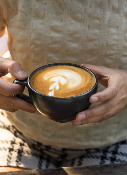 istock Woman drinking hot latte coffee. 827429362