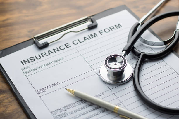 istock health insurance claim form with stethoscope on wood table selective focus 827429696