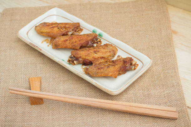 This is a photo of delicious, golden-brown Chicken Drumettes served simply on white tableware. It is an appetizing dish that conveys the warm atmosphere of home cooking, perfect for food blogs and recipes.