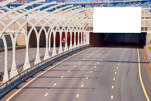 istock Tunnel on highway with blank billboard over it 827432710