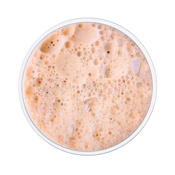 istock Cream colored beer foam into glass. Top view. 827432938