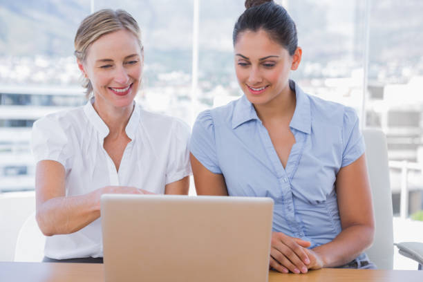 istock Businesswomen looking at laptop 827433990