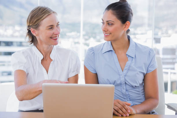 istock Businesswomen working with laptop 827434004