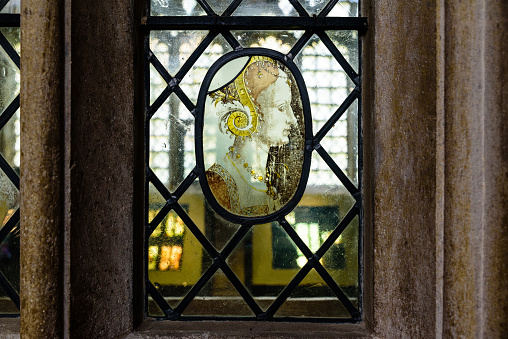 Abstract Geometric Yin Yang Leaded Stained Glass Panel Hanging over a Window.