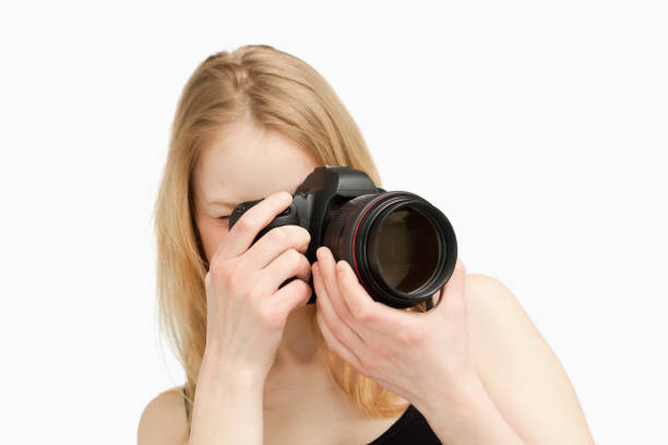 istock Woman taking a photography with a singlelens reflex camera 827442224