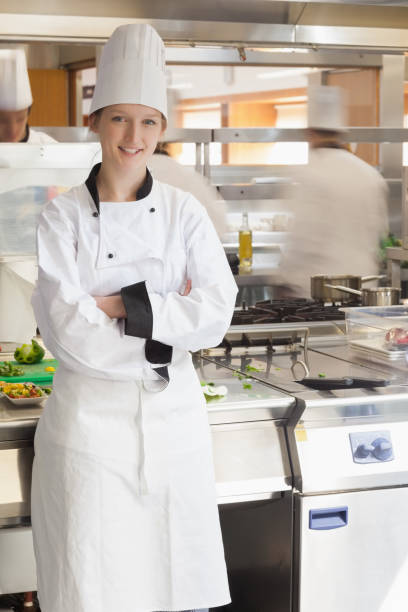 istock Happy chef leaning against stove 827442372
