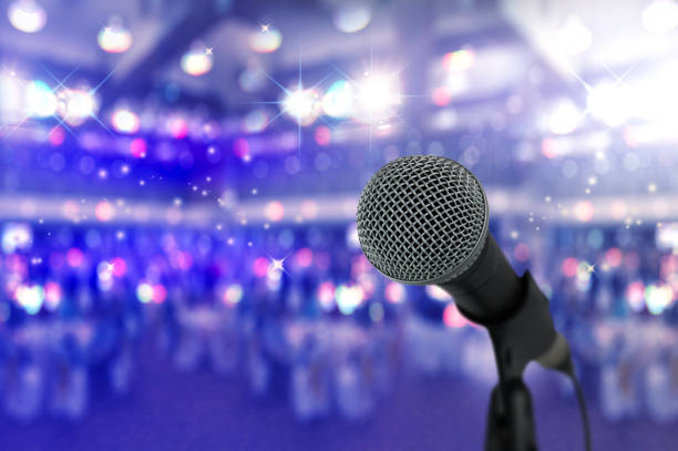istock Close up microphone  on stage in concert hall. 827453542