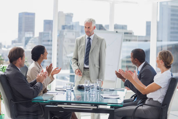 istock Colleagues applauding the boss during a meeting 827454346