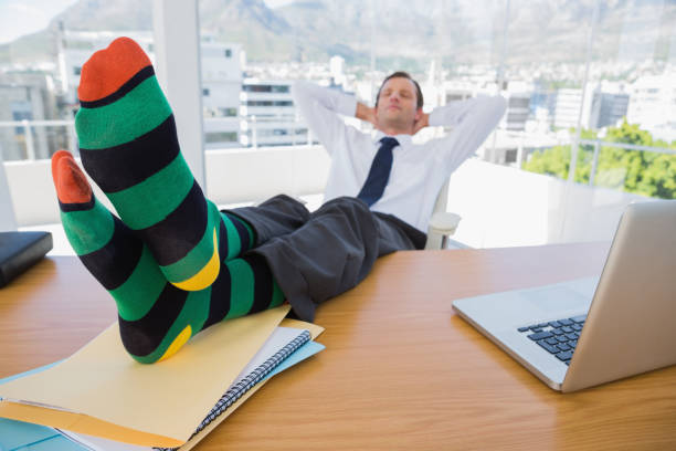 istock Business having a nap with feet on his desk 827456978